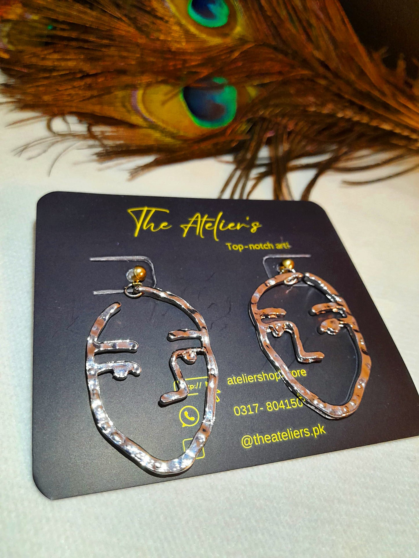 Metal face earrings